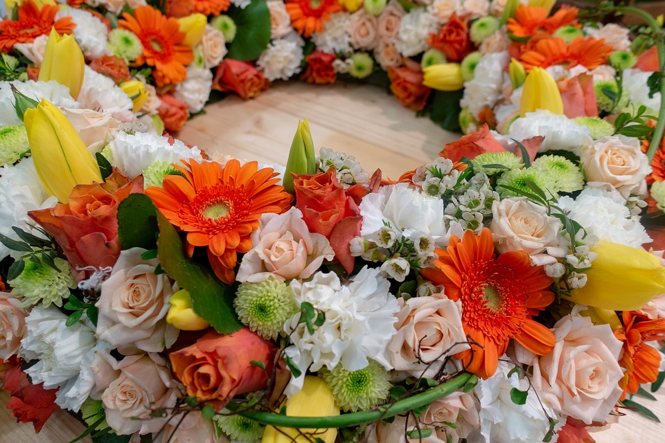 colorful sunflowers and roses in a wreath arrangement